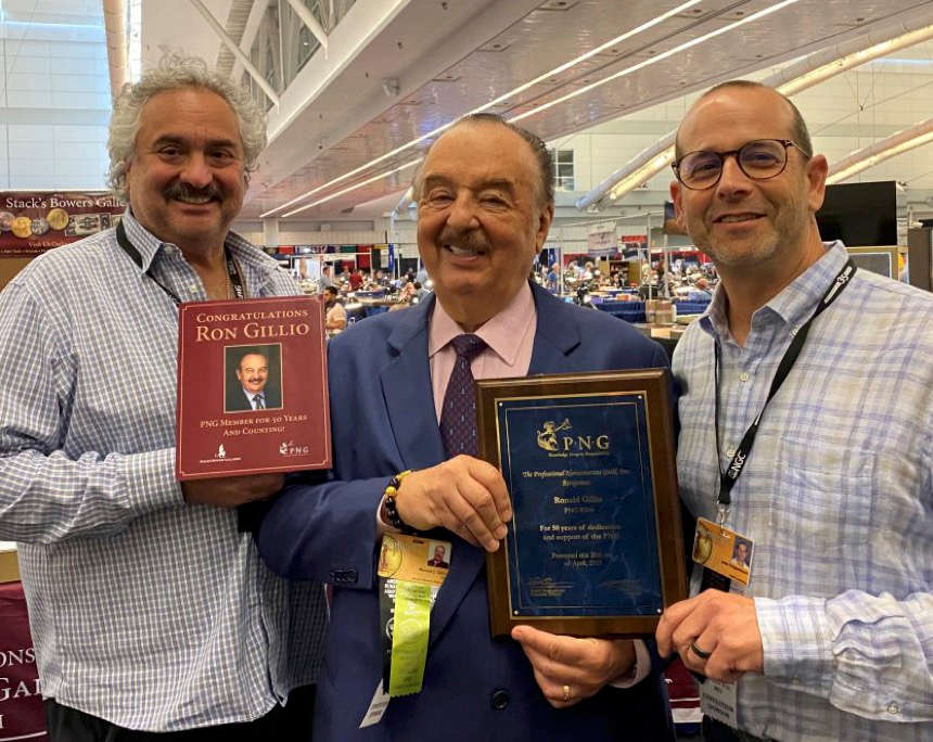 Ron Gillio (center) accepts a Professional Numismatists Guild 50-year membership plaque from long-time friend Kevin Lipton (left) and PNG Executive Director John Feigenbaum (right) at the American Numismatic Association 2023 Pittsburgh World’s Fair of Money on August 8, 2023. Photo credit: Donn Pearlman.