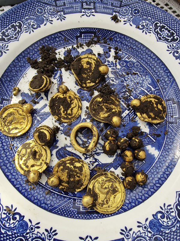 The gold treasure photographed immediately after Erlend Bore unearthed it with a metal detector. © Erlend Bore.