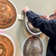 Dr. Daniel Harmelink, Executive Director of Concordia Historical Institute and President of the International Association of Reformation Coins and Medals, prepares the exhibit hall for the special exhibit. Photo: CHI.