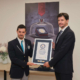 The representative of Guinness World Records hands over the certificate for the world’s smallest coin to Robert Blaic, CEO of the Croatian Mint. Photo: Croatian Mint.